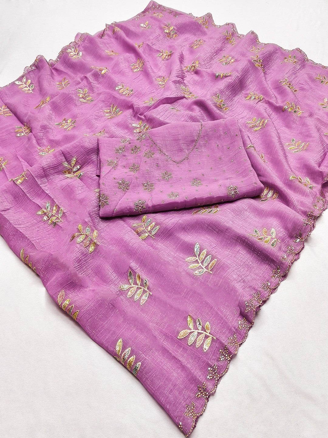 An Elegant Pink Chiffon Saree Adorned with Delicate Leaf Embellishments