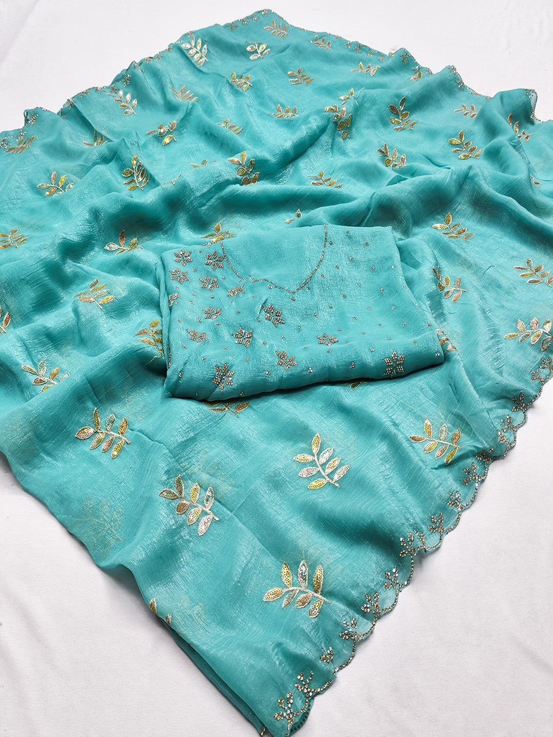 An Elegant Turquoise Chiffon Saree Adorned with Delicate Leaf Embellishments