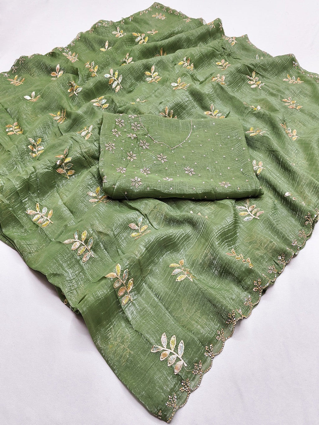 An Elegant Green Chiffon Saree Adorned with Delicate Leaf Embellishments
