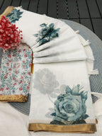 Elegant White Linen Saree with Floral Print and Golden Border