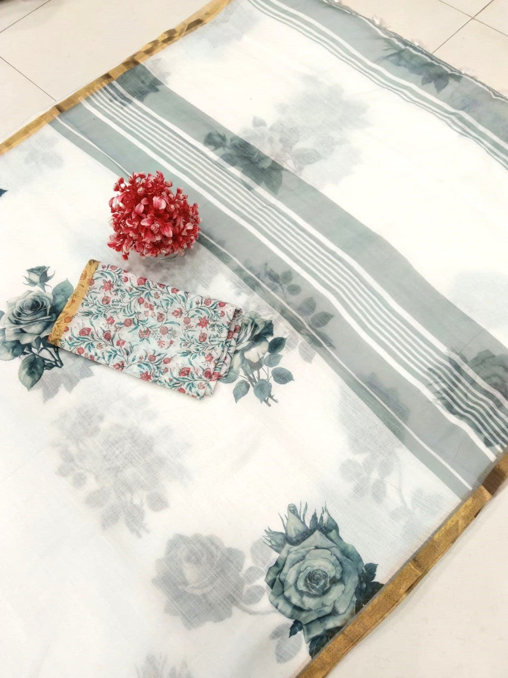 Elegant White Linen Saree with Floral Print and Golden Border