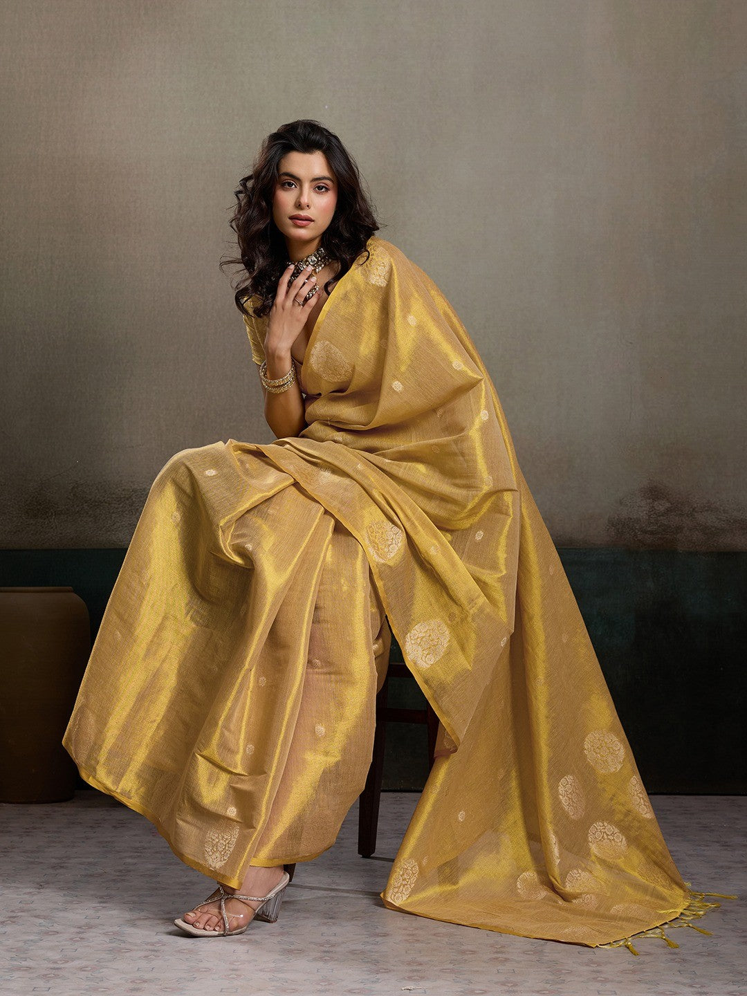 Stylish Beige Tissue Saree with Fine Woven Floral Patterns and Glossy Finish