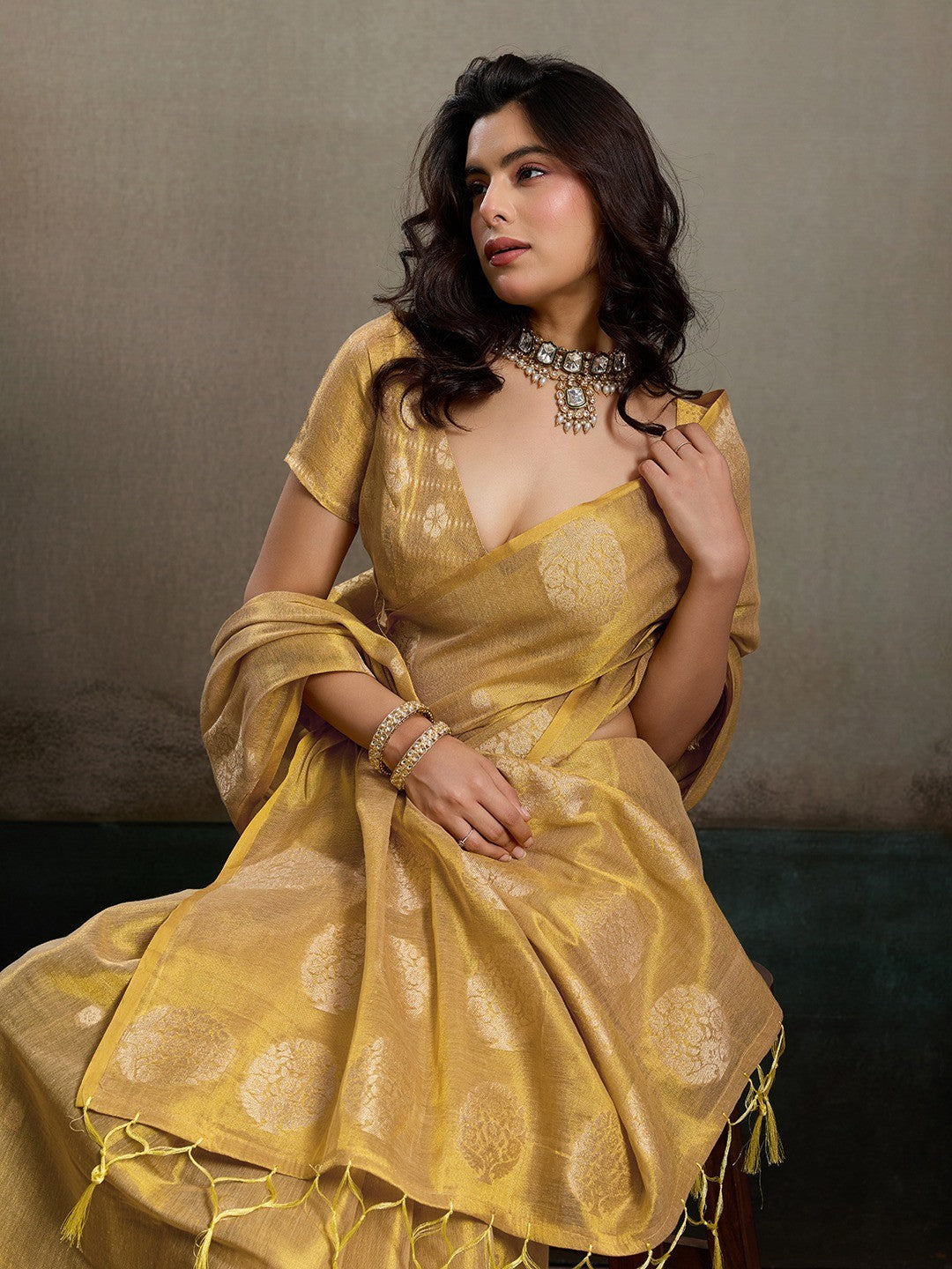 Stylish Beige Tissue Saree with Fine Woven Floral Patterns and Glossy Finish