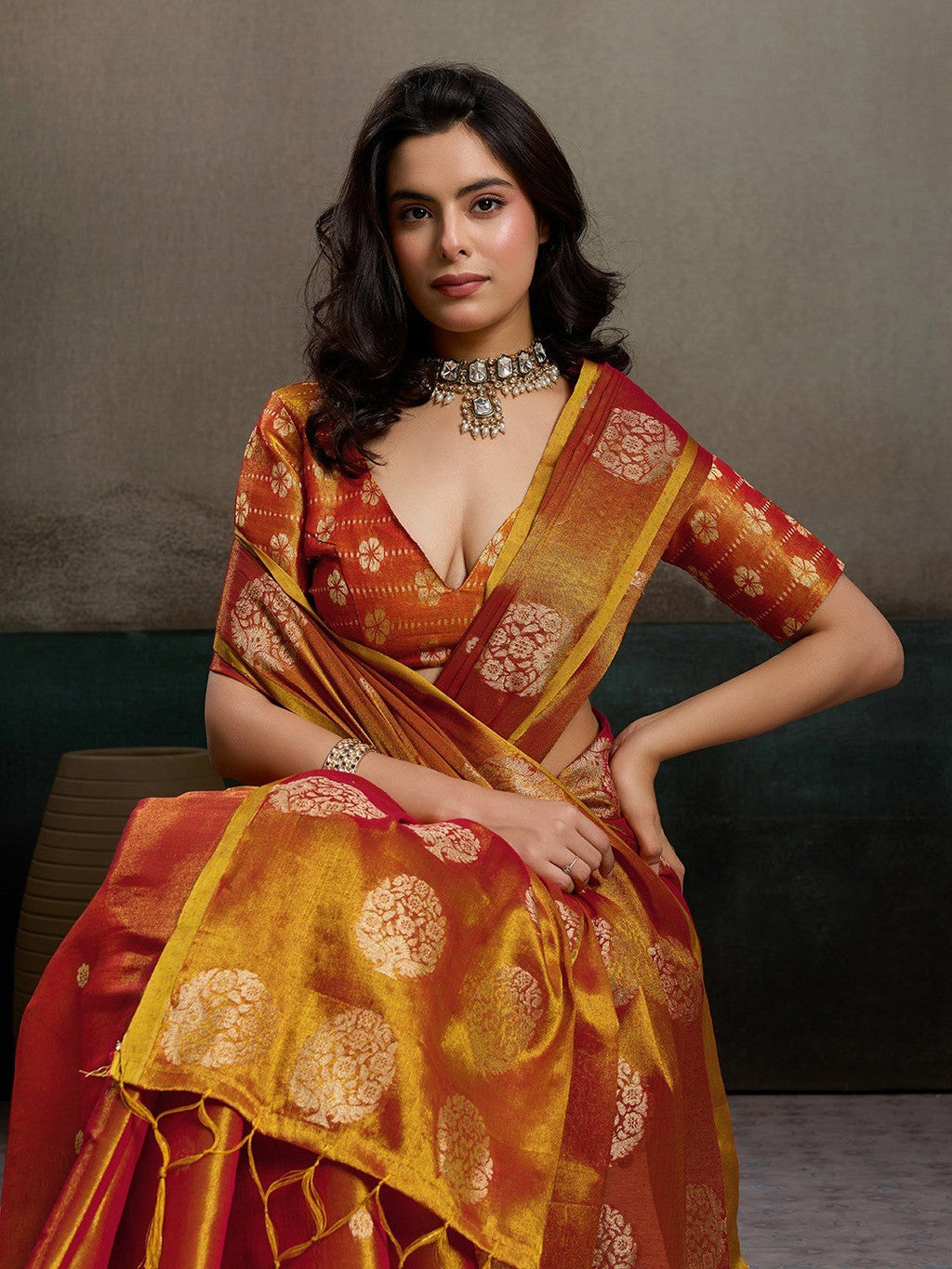 Stylish Orange Tissue Saree with Fine Woven Floral Patterns and Glossy Finish