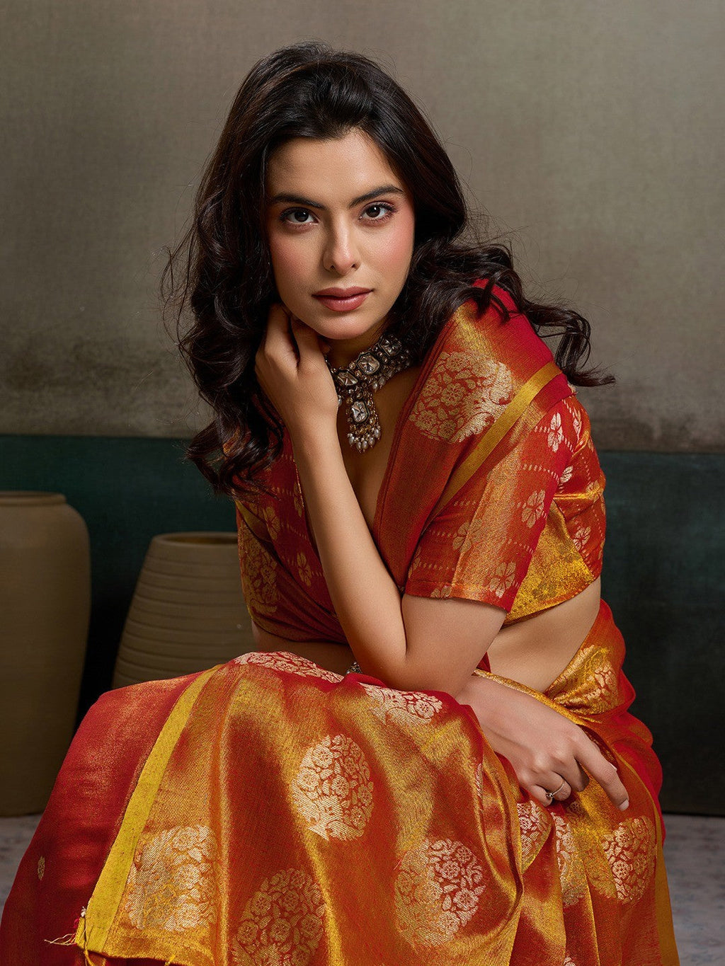 Stylish Orange Tissue Saree with Fine Woven Floral Patterns and Glossy Finish