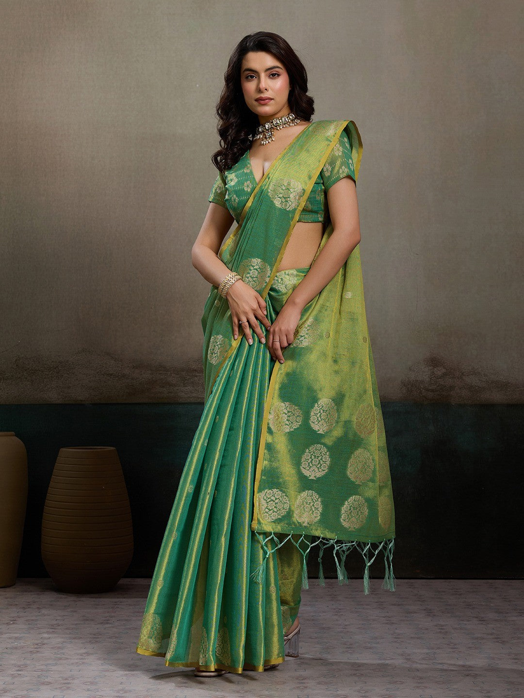 Stylish Green Tissue Saree with Fine Woven Floral Patterns and Glossy Finish