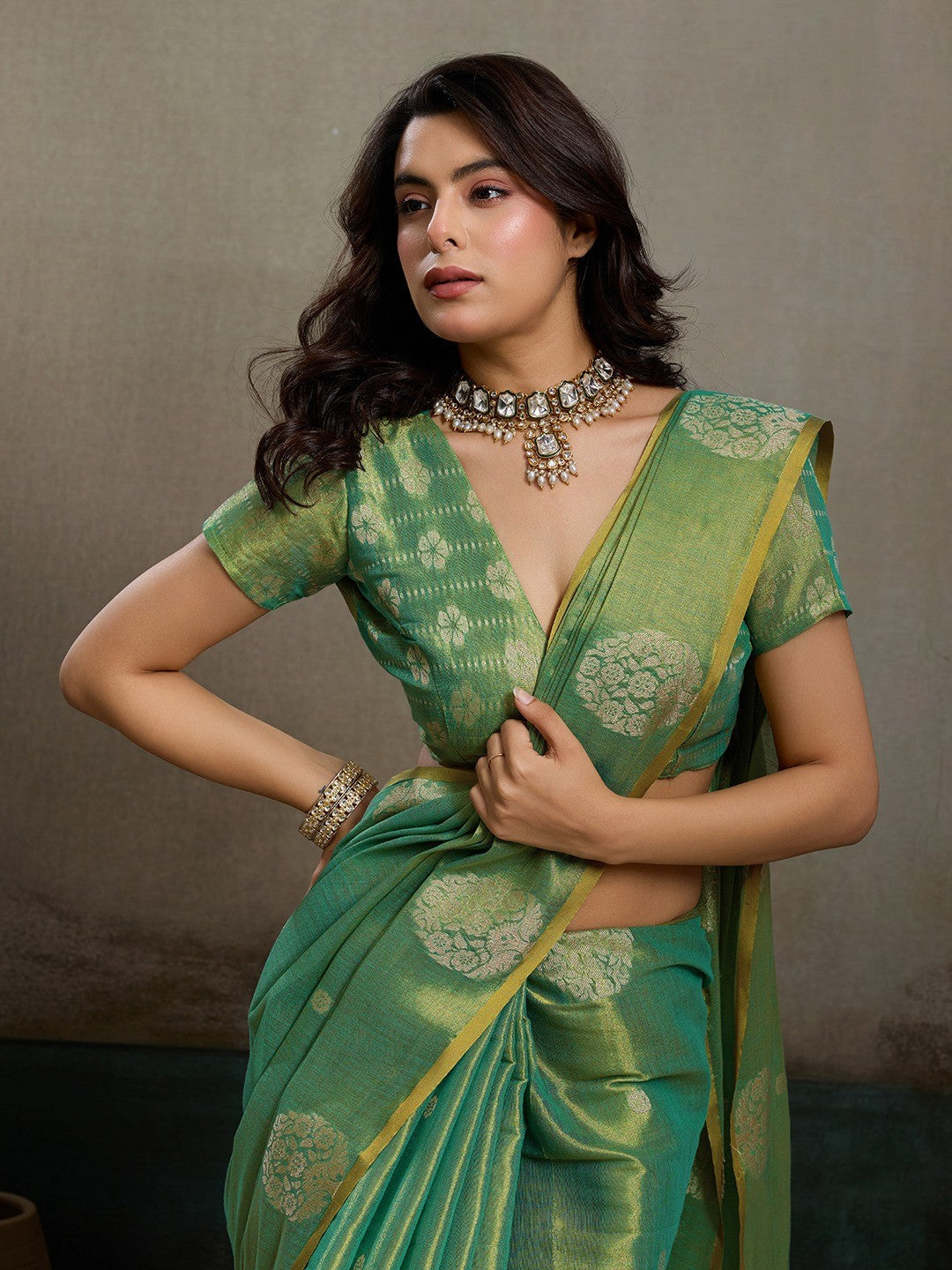 Stylish Green Tissue Saree with Fine Woven Floral Patterns and Glossy Finish