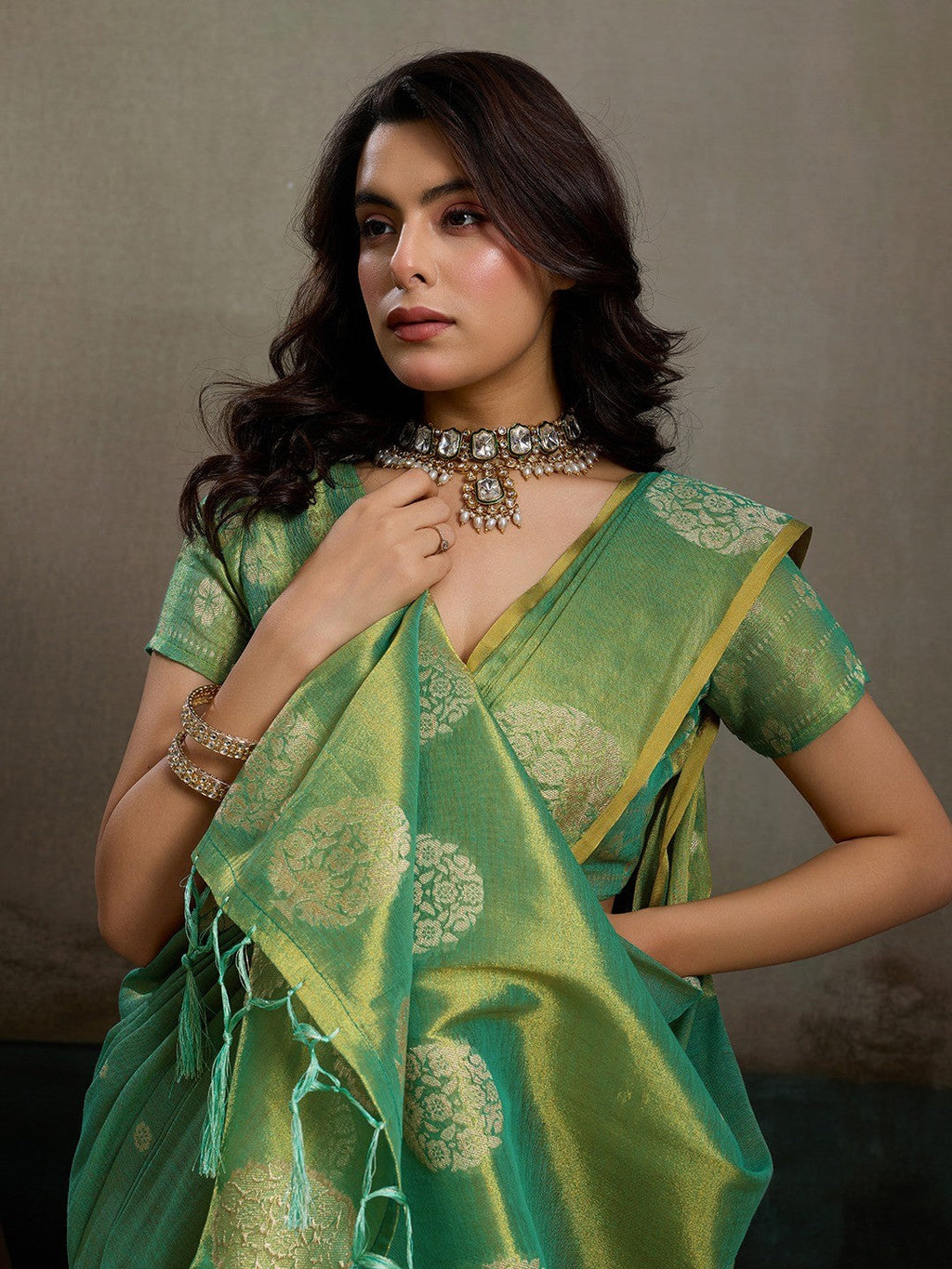Stylish Green Tissue Saree with Fine Woven Floral Patterns and Glossy Finish