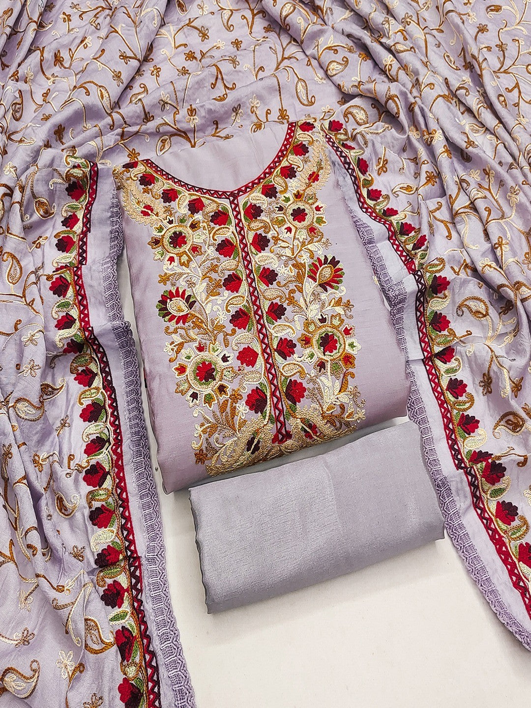 Ethnic Lavender Roman Art Silk Dress Material Highlighted With Floral & Paisley Thread Embroidery
