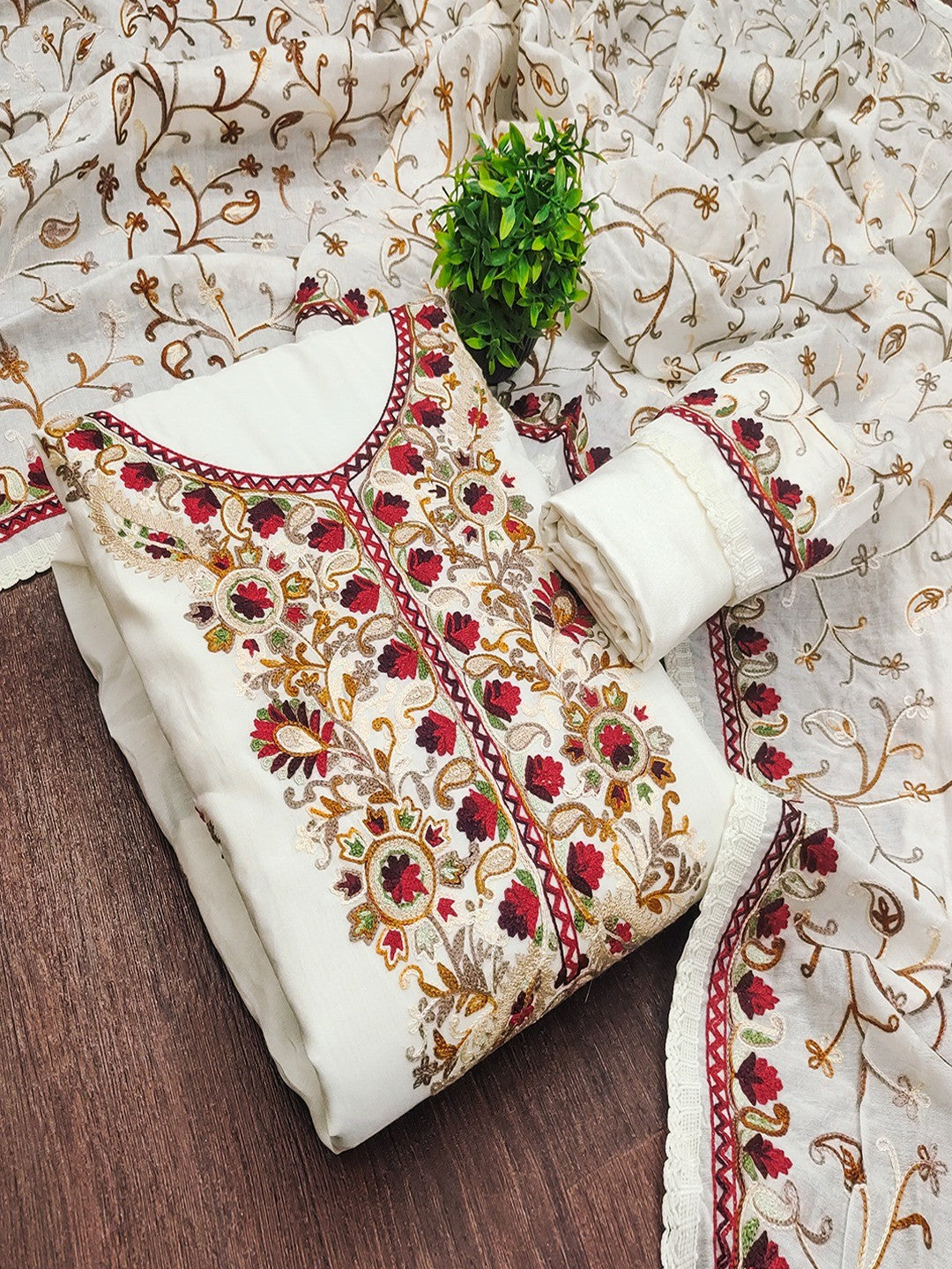 Ethnic Offwhite Roman Art Silk Dress Material Highlighted With Floral & Paisley Thread Embroidery