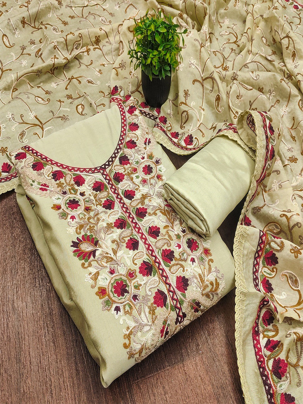 Ethnic Pista Green Roman Art Silk Dress Material Highlighted With Floral & Paisley Thread Embroidery
