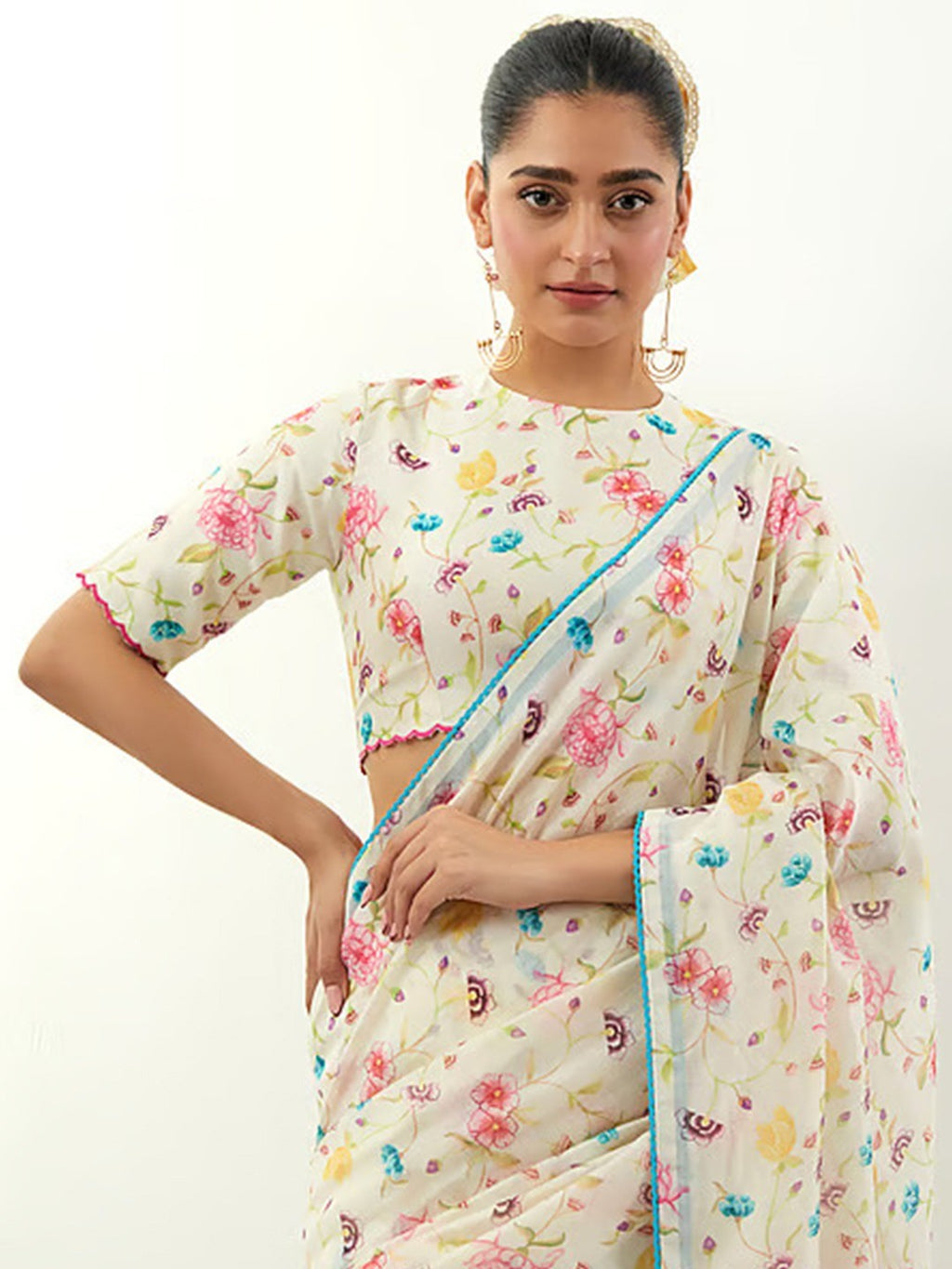 Stylish Cream Floral Print Georgette Saree Highlighted With Lace Border Finish