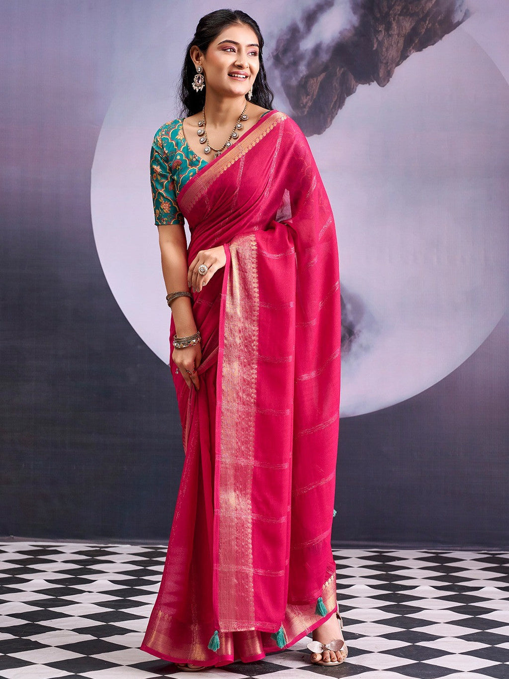 Charming Pink Striped Zari Woven Georgette Saree With Graceful Tassel Finish