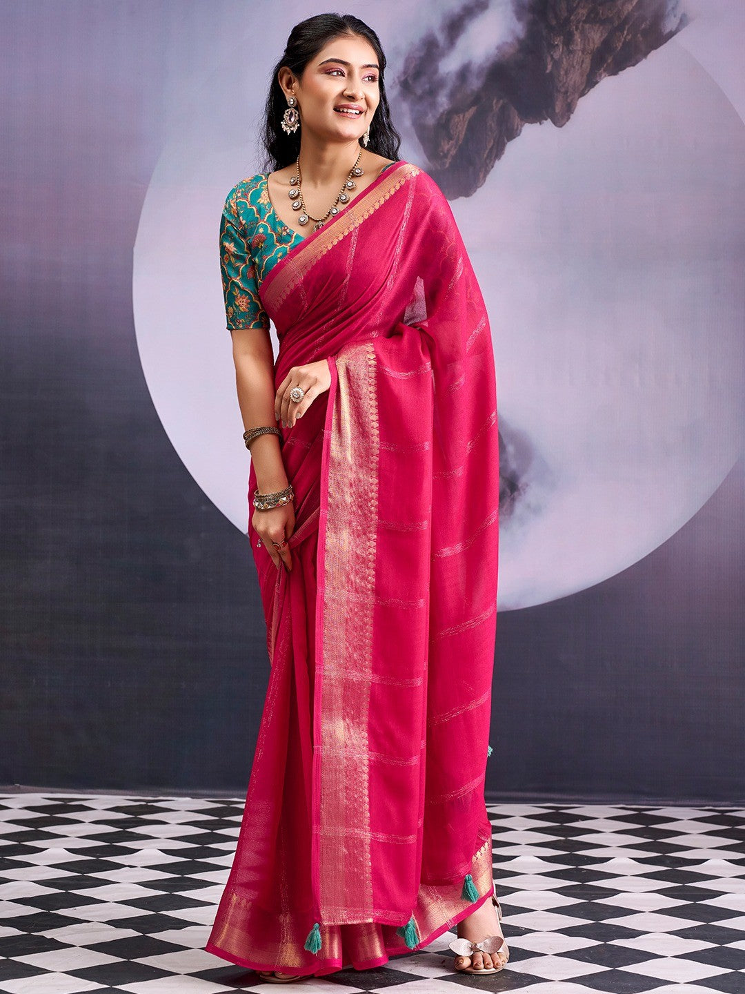 Charming Pink Striped Zari Woven Georgette Saree With Graceful Tassel Finish