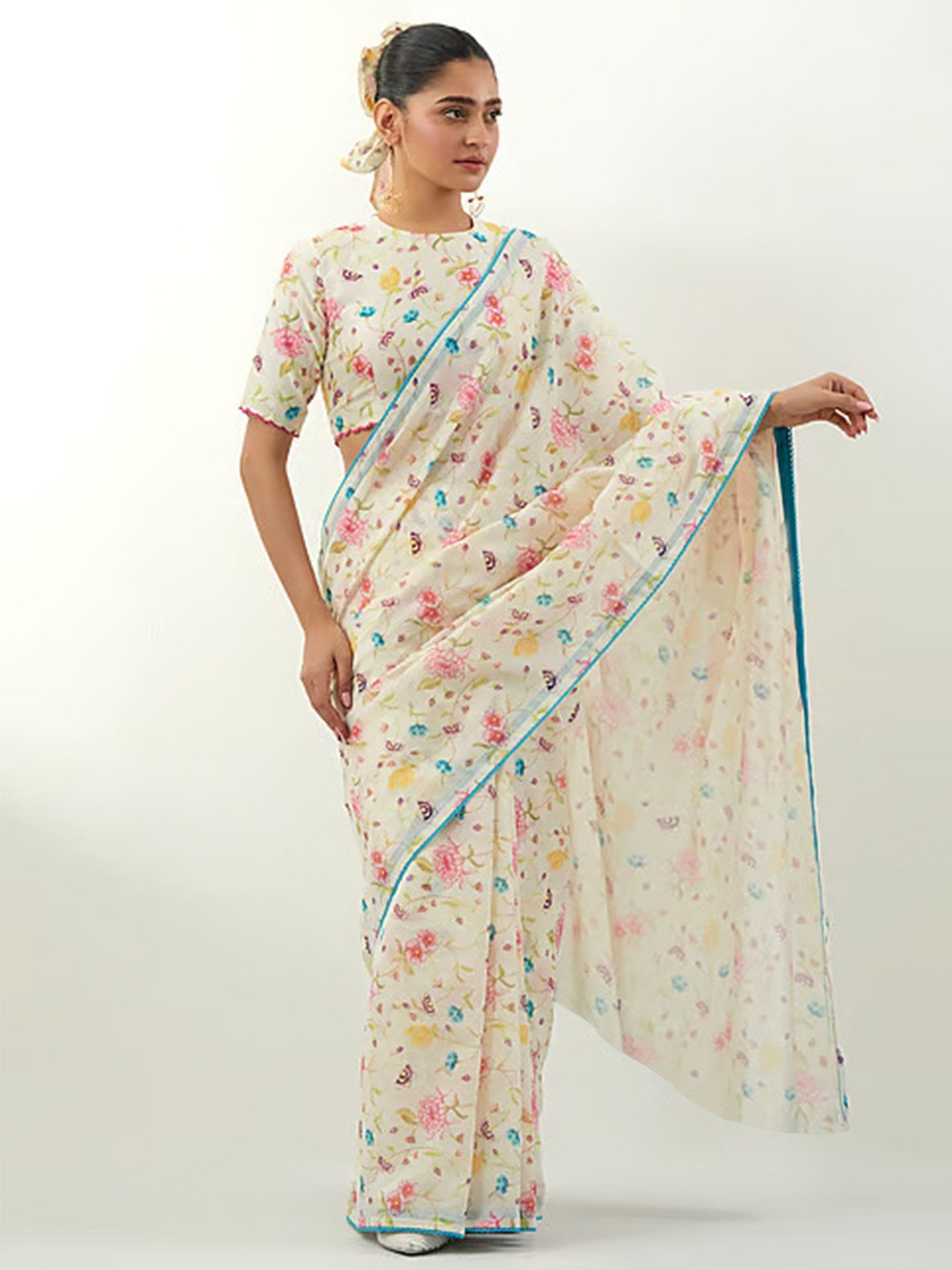Stylish Cream Floral Print Georgette Saree Highlighted With Lace Border Finish