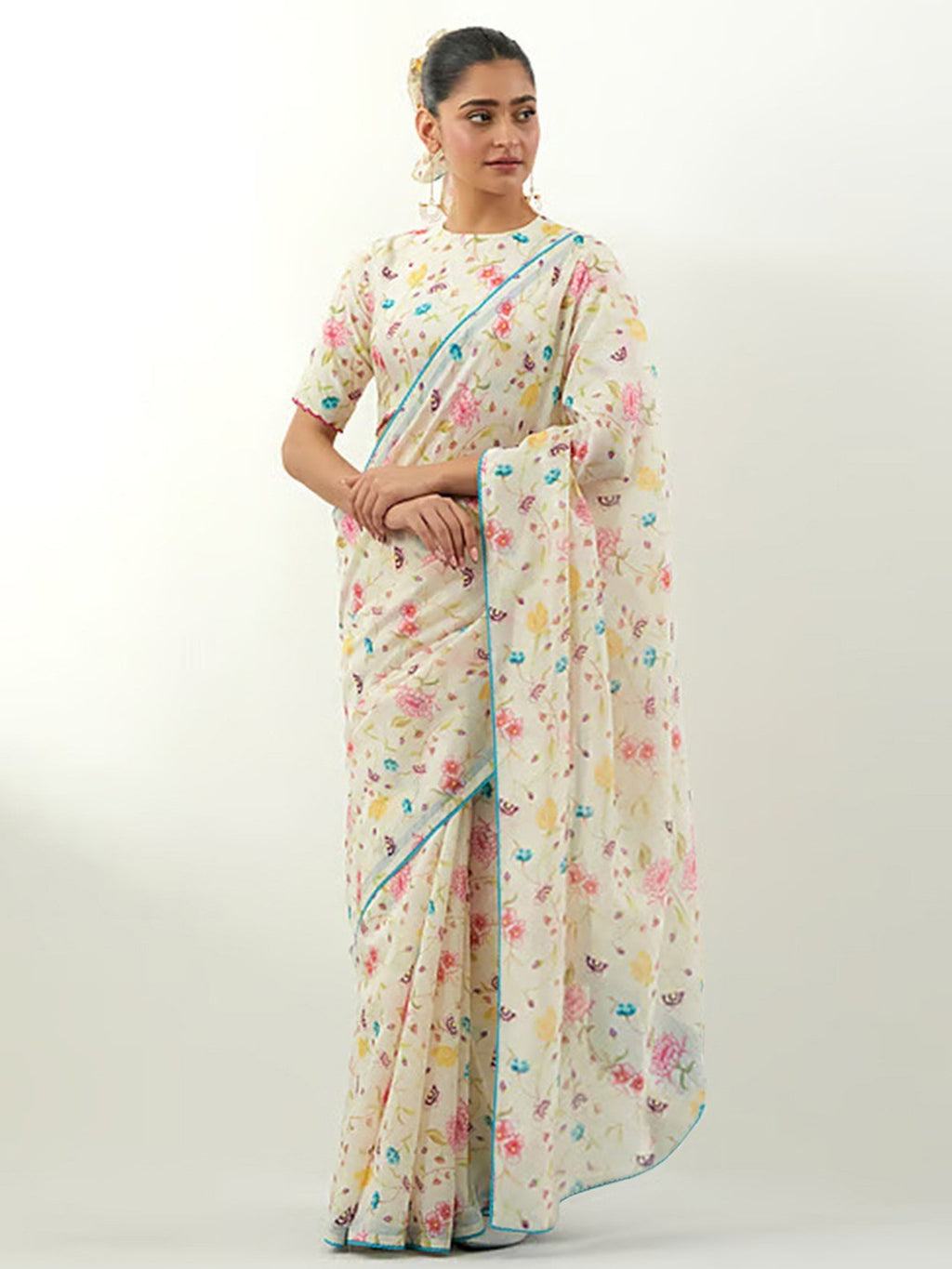 Stylish Cream Floral Print Georgette Saree Highlighted With Lace Border Finish