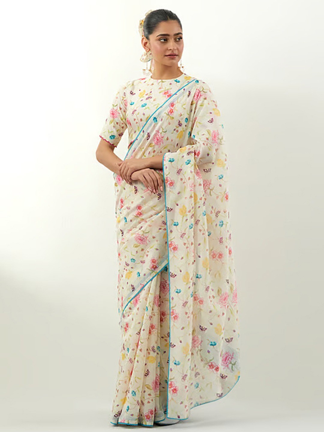 Stylish Cream Floral Print Georgette Saree Highlighted With Lace Border Finish