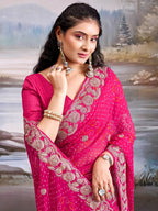 Graceful Pink Bandhani Print Georgette Saree Highlighted With Floral Embroidery Work Border