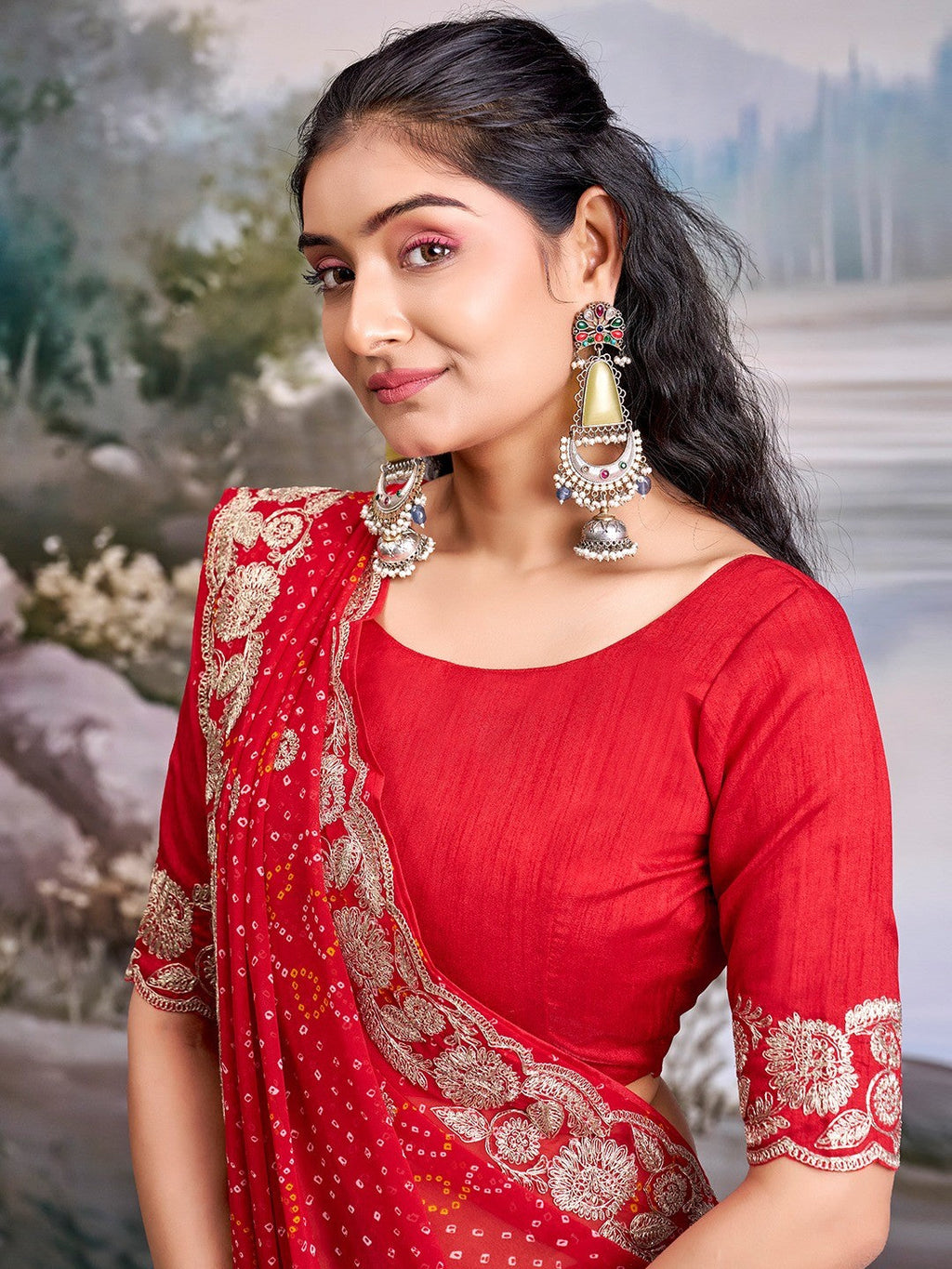 Graceful Red Bandhani Print Georgette Saree Highlighted With Floral Embroidery Work Border