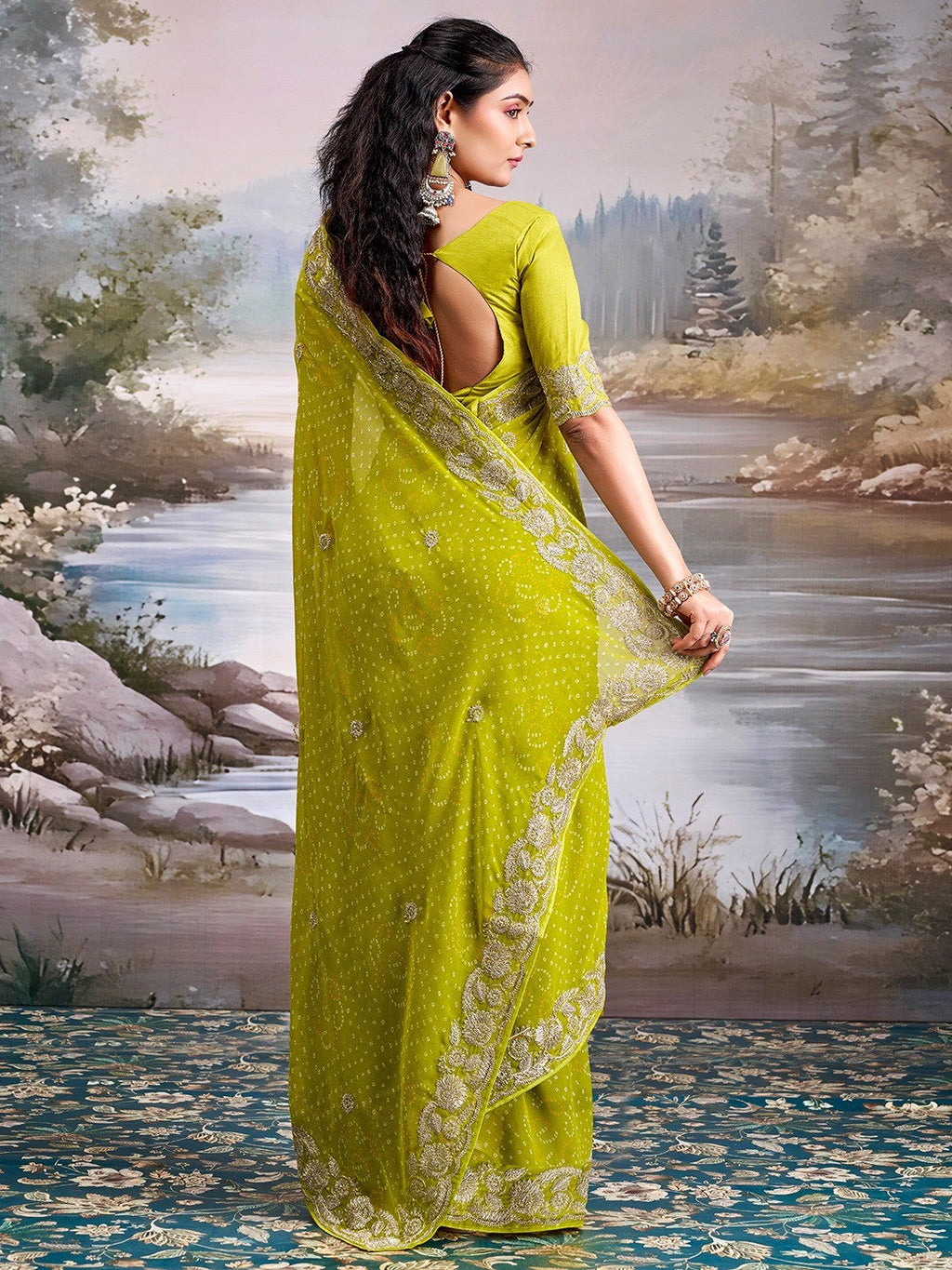 Graceful Green Bandhani Print Georgette Saree Highlighted With Floral Embroidery Work Border