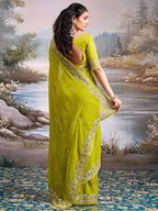 Graceful Green Bandhani Print Georgette Saree Highlighted With Floral Embroidery Work Border