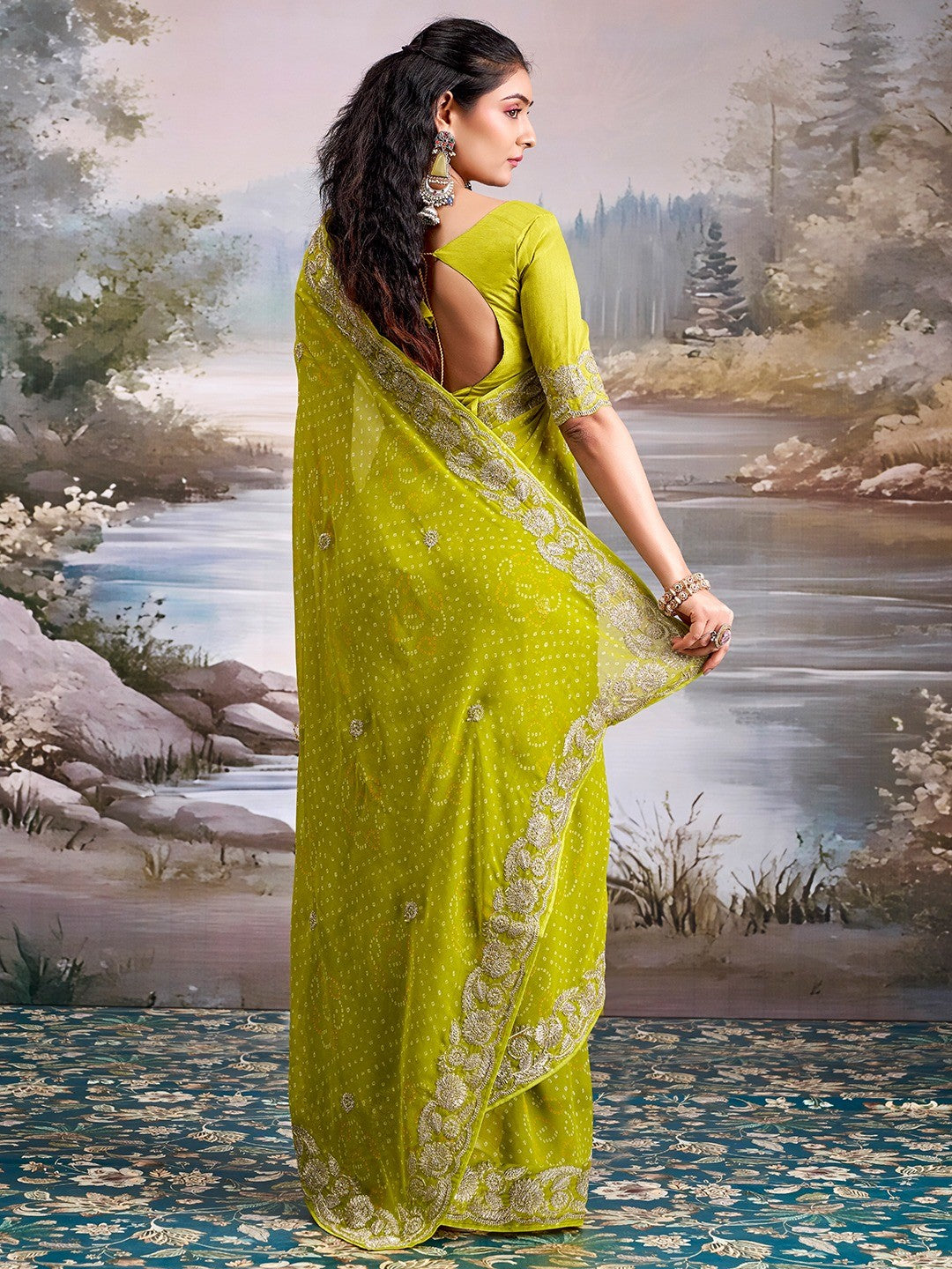 Graceful Green Bandhani Print Georgette Saree Highlighted With Floral Embroidery Work Border