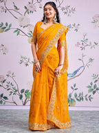Graceful Mustard Bandhani Print Georgette Saree Highlighted With Floral Embroidery Work Border