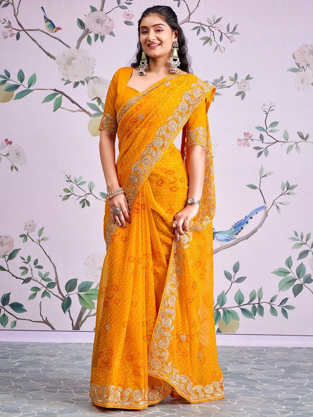 Graceful Mustard Bandhani Print Georgette Saree Highlighted With Floral Embroidery Work Border