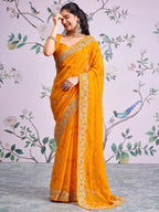 Graceful Mustard Bandhani Print Georgette Saree Highlighted With Floral Embroidery Work Border