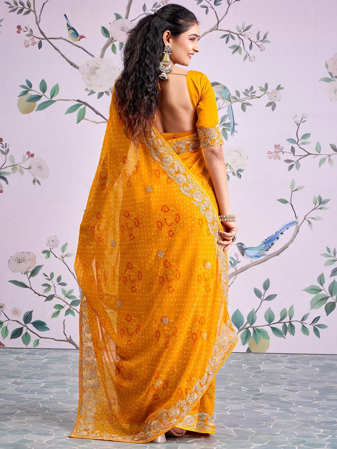 Graceful Mustard Bandhani Print Georgette Saree Highlighted With Floral Embroidery Work Border