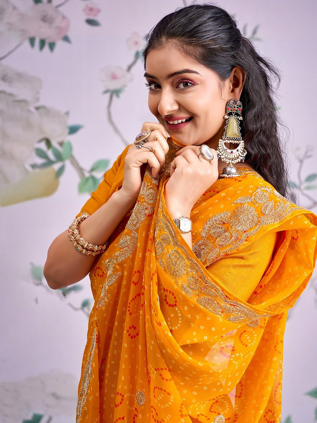 Graceful Mustard Bandhani Print Georgette Saree Highlighted With Floral Embroidery Work Border