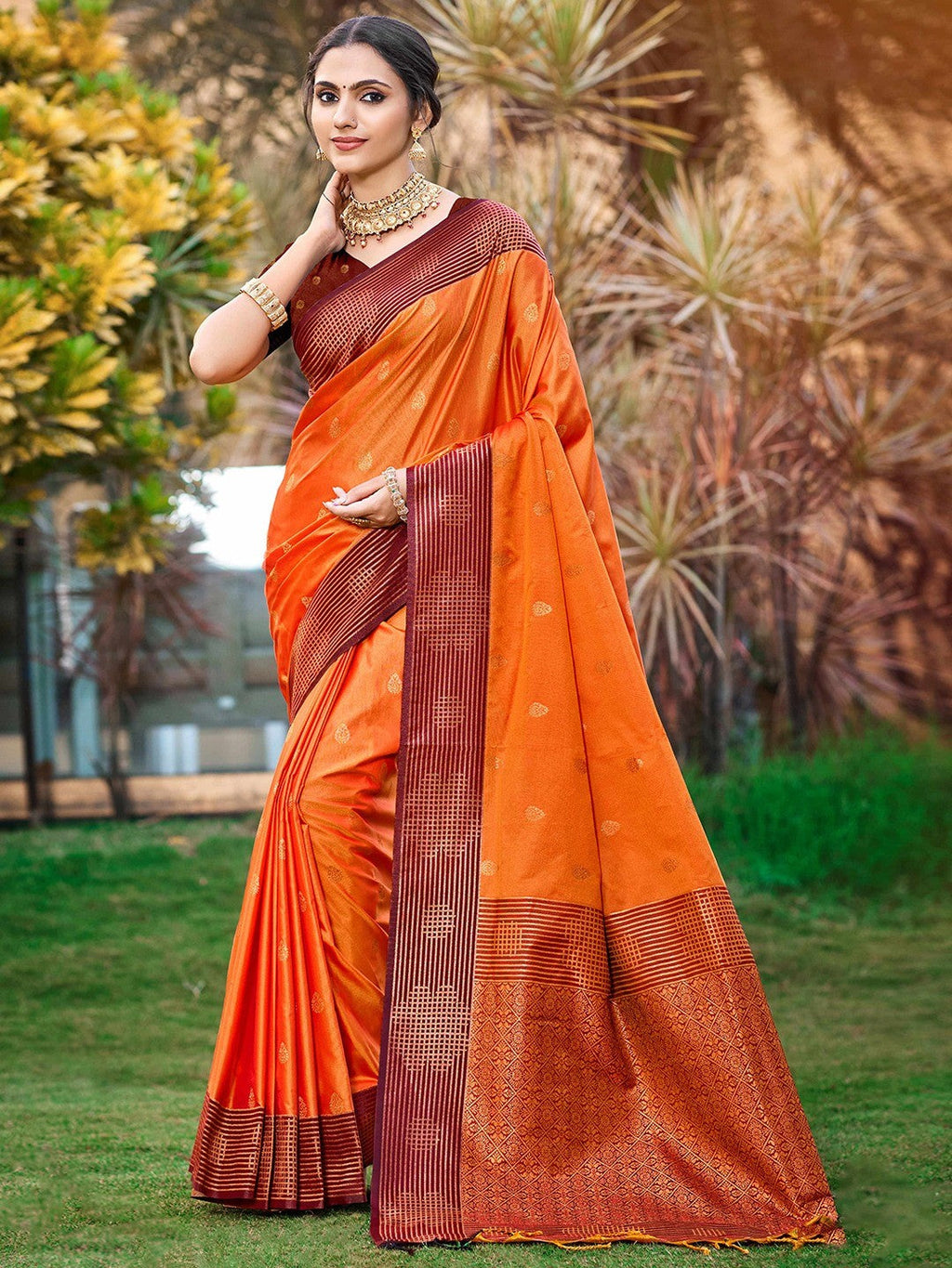 Graceful Orange Zari Woven Silk Blend Saree With Floral Motif Detailing & Elegant Tassels Pallu
