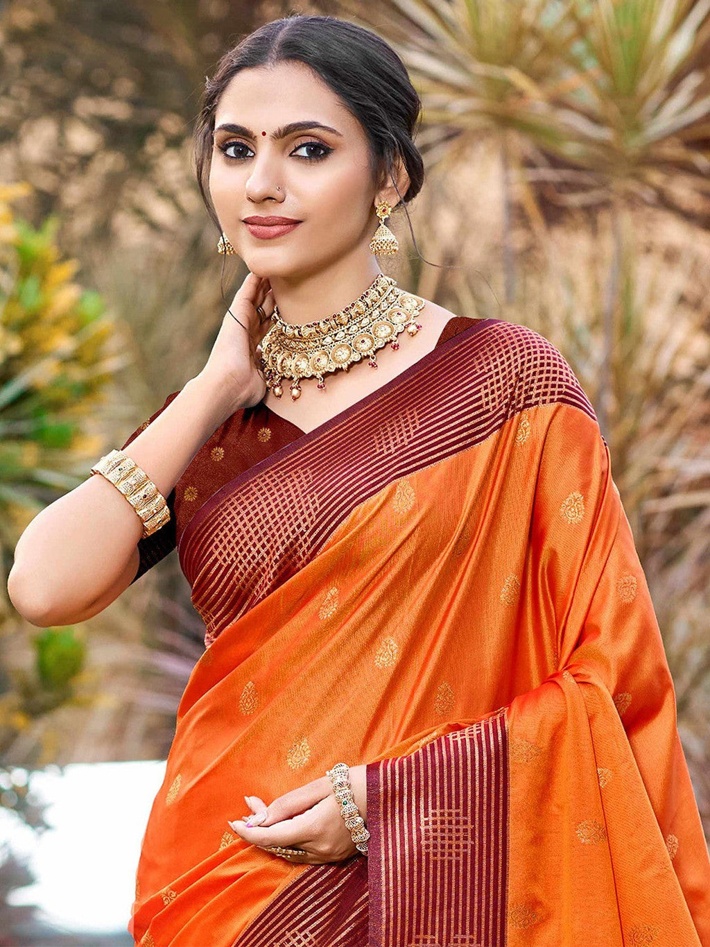 Graceful Orange Zari Woven Silk Blend Saree With Floral Motif Detailing & Elegant Tassels Pallu