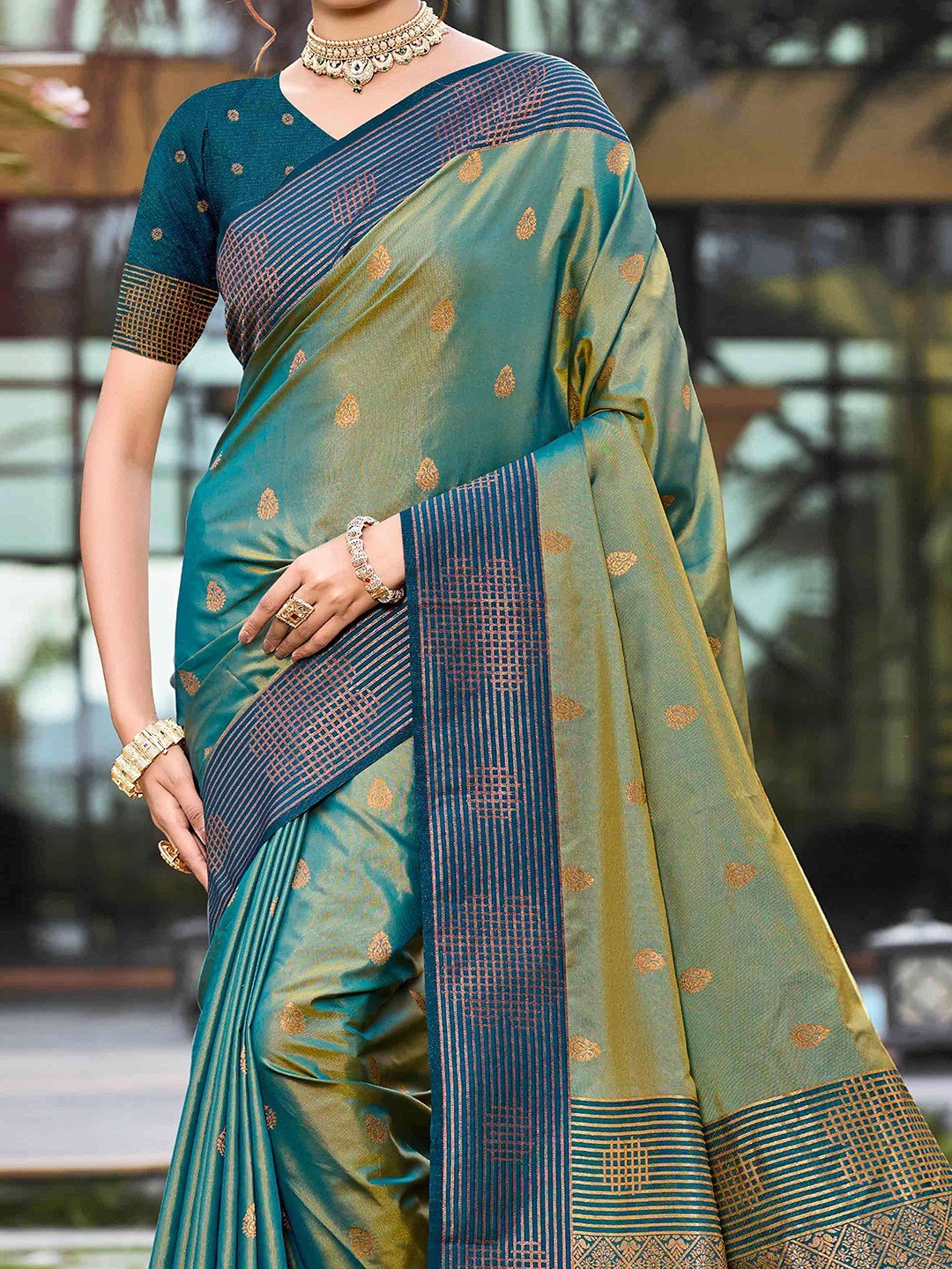 Graceful Rama Green Zari Woven Silk Blend Saree With Floral Motif Detailing & Elegant Tassels Pallu