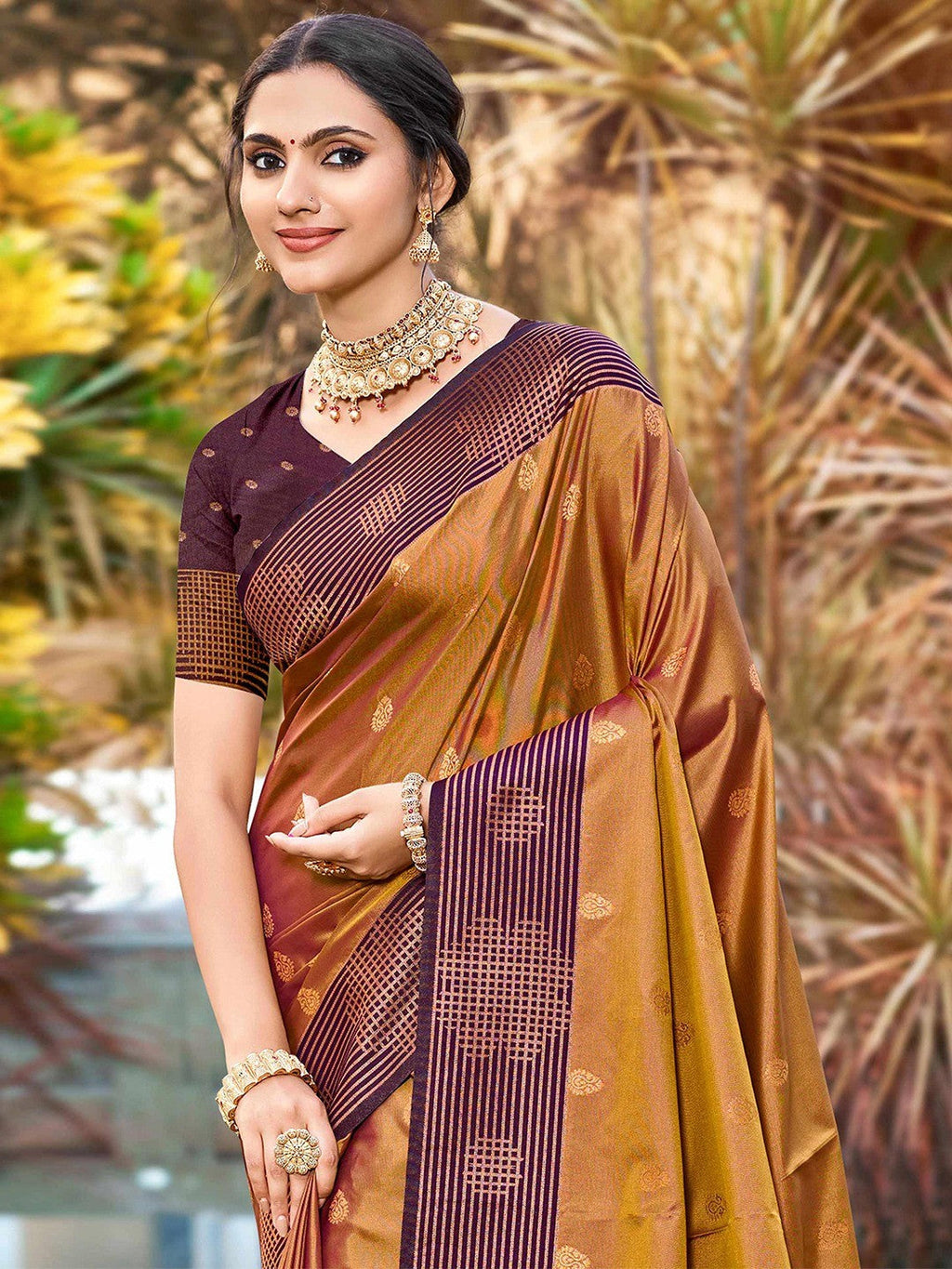 Graceful Golden Brown Zari Woven Silk Blend Saree With Floral Motif Detailing & Elegant Tassels Pallu