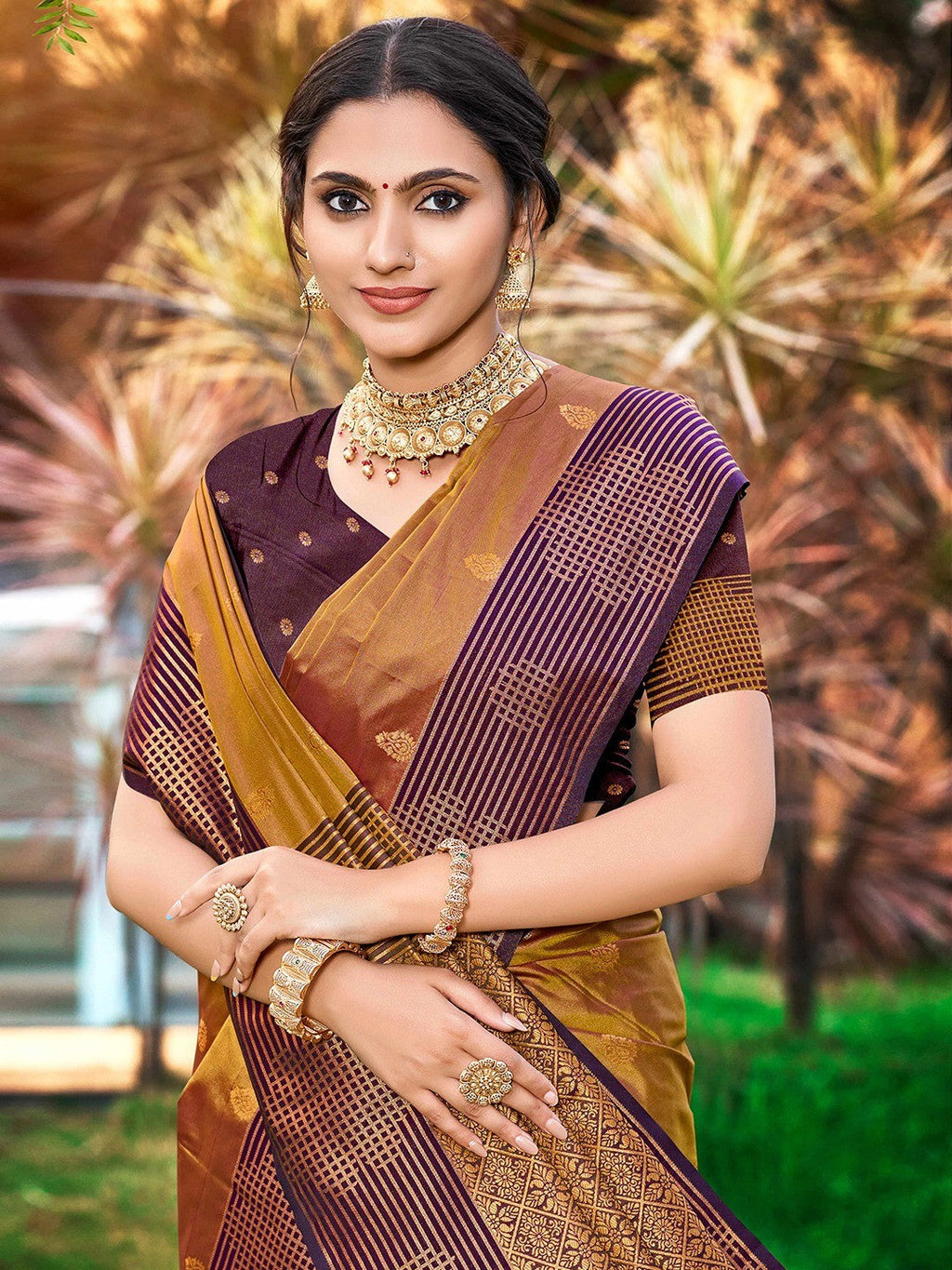 Graceful Golden Brown Zari Woven Silk Blend Saree With Floral Motif Detailing & Elegant Tassels Pallu