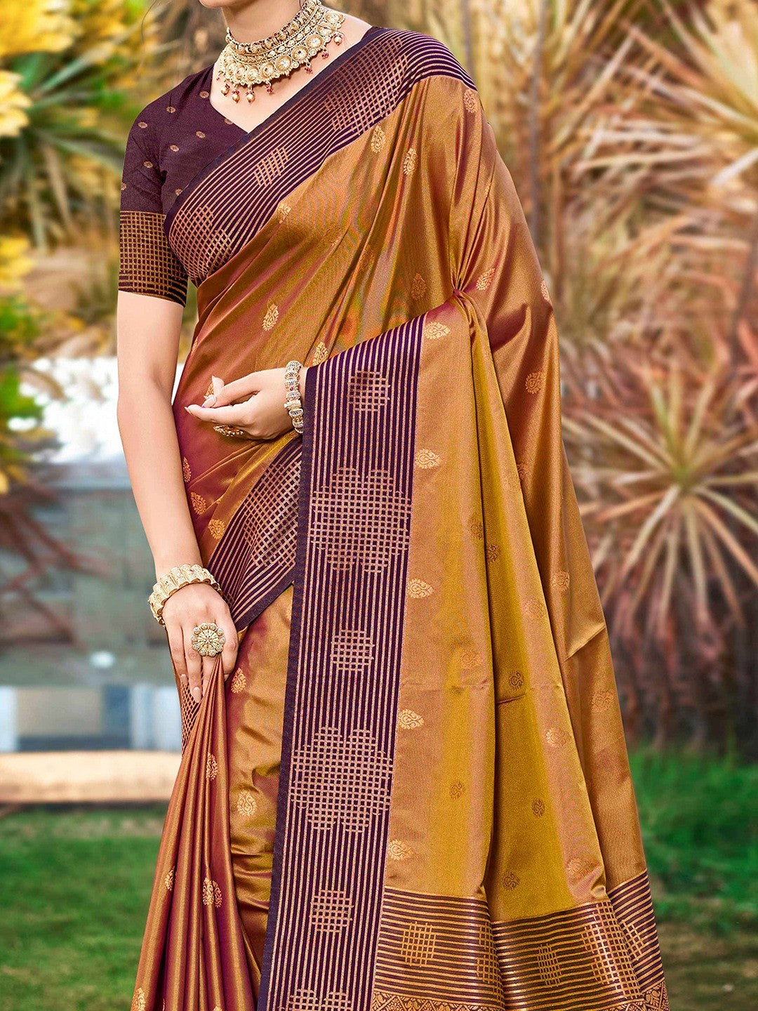 Graceful Golden Brown Zari Woven Silk Blend Saree With Floral Motif Detailing & Elegant Tassels Pallu