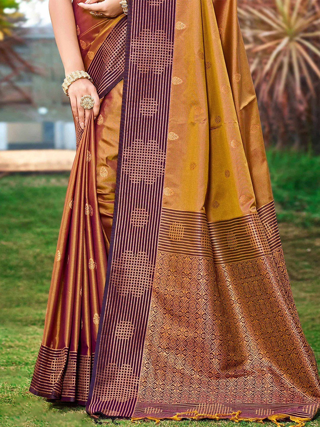Graceful Golden Brown Zari Woven Silk Blend Saree With Floral Motif Detailing & Elegant Tassels Pallu