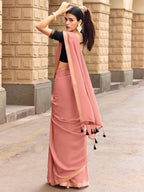 Charming Peach Solid Mulmul Cotton Saree Highlighted By Zari Weaving Border & Tassel Pallu