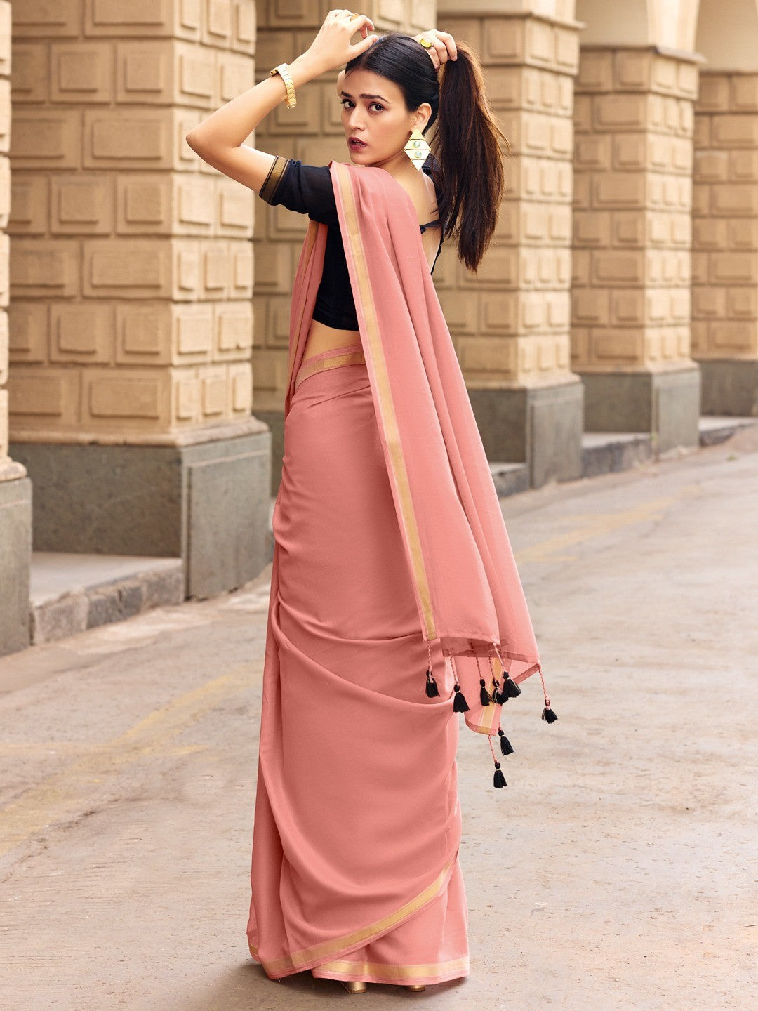 Charming Peach Solid Mulmul Cotton Saree Highlighted By Zari Weaving Border & Tassel Pallu