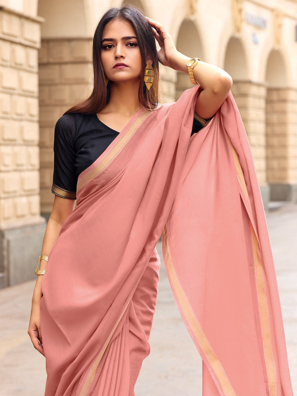 Charming Peach Solid Mulmul Cotton Saree Highlighted By Zari Weaving Border & Tassel Pallu