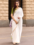 Charming White Solid Mulmul Cotton Saree Highlighted By Zari Weaving Border & Tassel Pallu