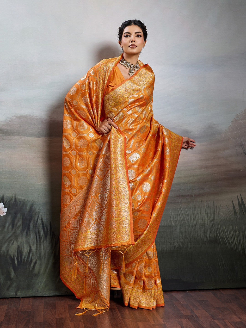 Elegant Orange Floral & Elephant Motif Silk Blend Saree with Zari Work