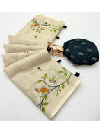Stylish Cream Linen Saree with Multicolor Printed Motifs Minimal Elegant Look
