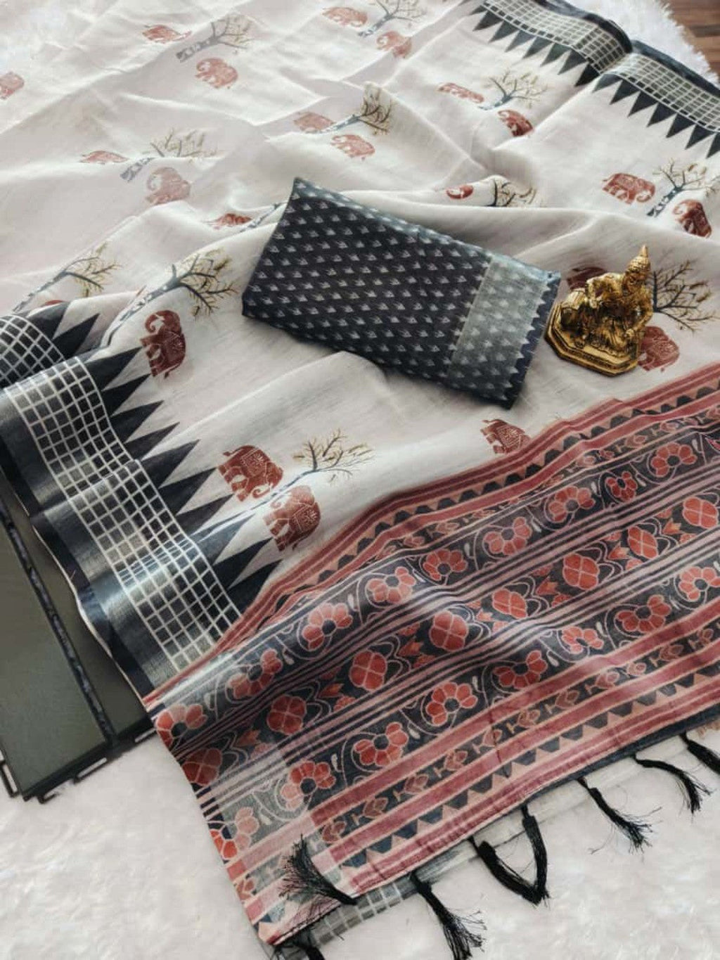 Elegant Grey Linen Saree With Elephant Print and Zig Zag Geometric Border