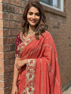 Sophisticated Coral Pink Striped Pattern Georgette Saree With Floral Thread Embroidered Border