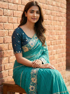 Sophisticated Teal Striped Pattern Georgette Saree With Floral Thread Embroidered Border