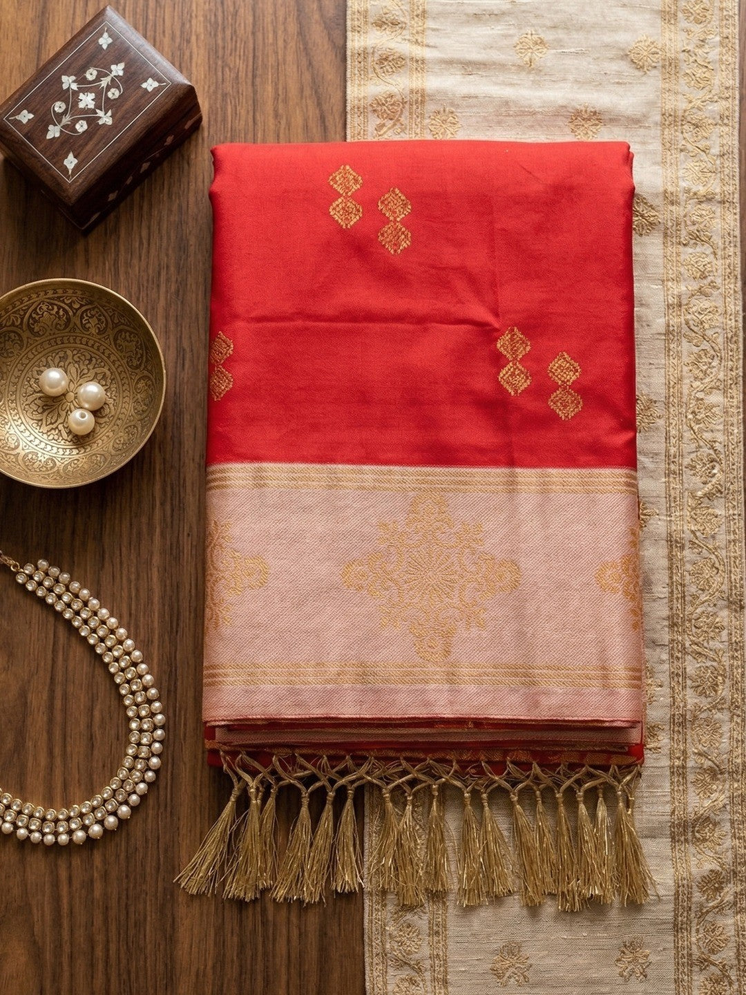 Elegant Red Floral Motif Silk Blend Saree Featuring Intricate Zari Weaving With Tassel Pallu