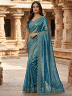 Graceful Teal Silk Blend Saree Accented With Swarovski Stone Work & Delicate Lace Border