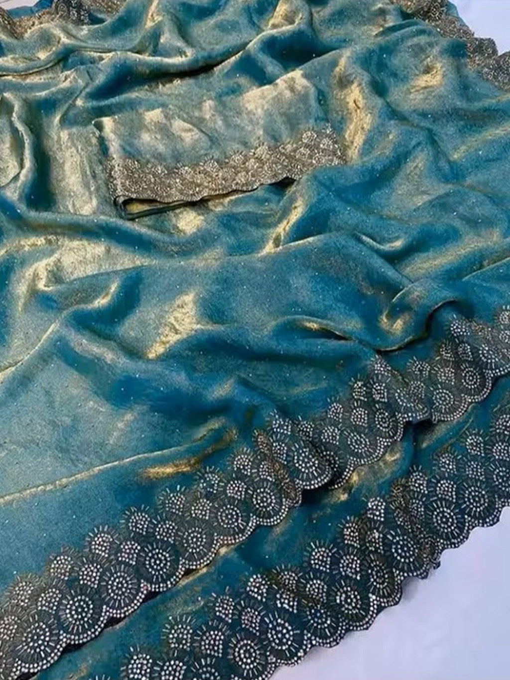 Graceful Teal Silk Blend Saree Accented With Swarovski Stone Work & Delicate Lace Border